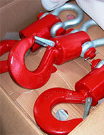 Supply of crane and hoist parts featuring clevis hooks with latch and round pin shackle.